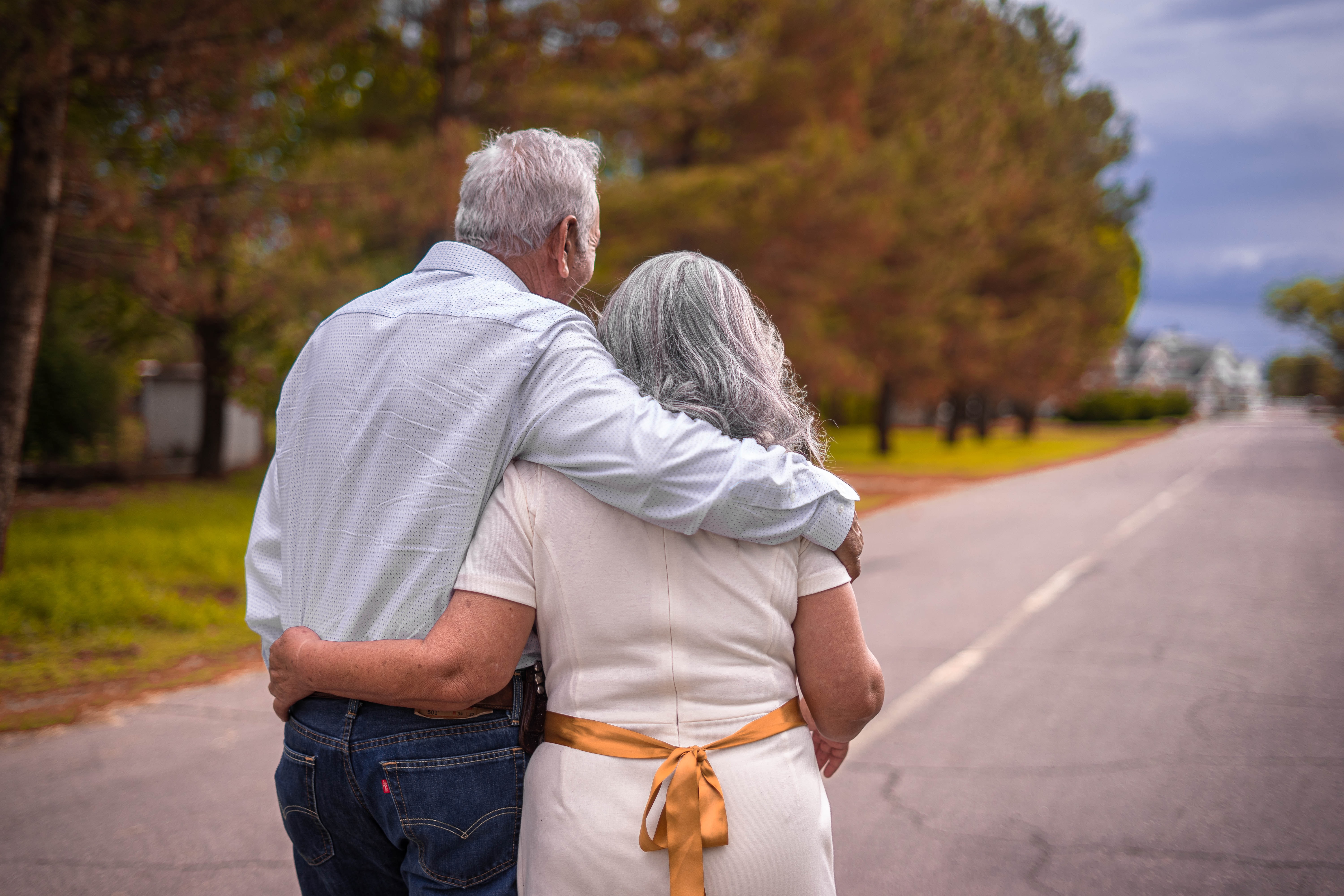 Older couple walking down the street