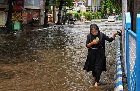 woman in flooded street