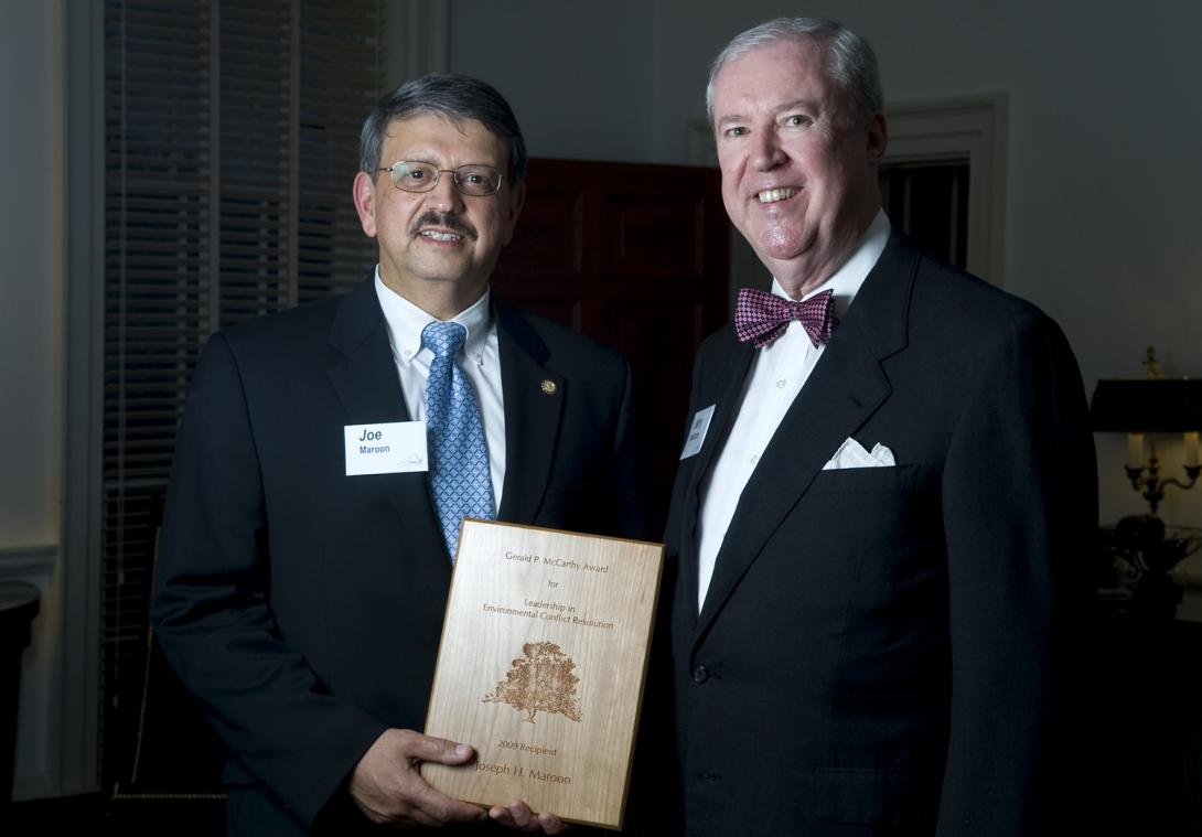 Joe Maroon receives McCarthy Award. Two men standing holding a plaque.