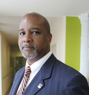 headshot of marcus comer