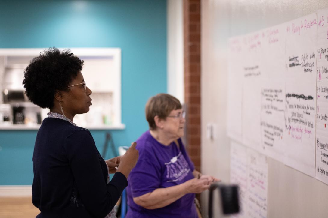 Two women participating in a RAFT workshop.